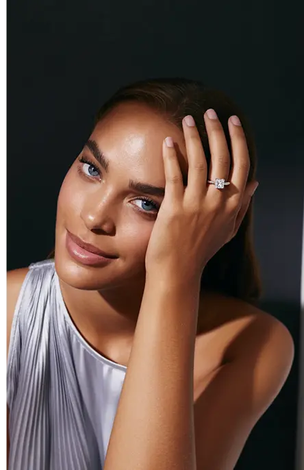 Confident woman with diamond ring